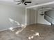 Spacious living room with tile flooring, ceiling fan, recessed lighting, and elegant chandelier at 2550 Bella Vista Dr, Davenport, FL 33897