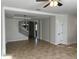 Open-concept living room with decorative ceilings, tile flooring, and chandelier at 2550 Bella Vista Dr, Davenport, FL 33897