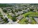 This aerial view shows well-maintained lawns and landscaping in a serene community setting at 265 Del Sol Ave, Davenport, FL 33837