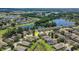 This aerial view highlights the scenic surroundings, including water features and manicured green spaces at 265 Del Sol Ave, Davenport, FL 33837