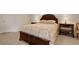 Bedroom featuring neutral carpeting and a bed with matching bedside tables and lamps at 265 Del Sol Ave, Davenport, FL 33837