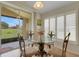 Bright dining area with a view to the backyard through sliding glass doors at 265 Del Sol Ave, Davenport, FL 33837