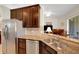 Kitchen features stainless steel appliances and granite countertops, perfect for meal preparation at 265 Del Sol Ave, Davenport, FL 33837