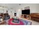 Inviting living room with a leather recliner, a TV, and an upright piano at 265 Del Sol Ave, Davenport, FL 33837