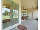Lovely outdoor patio with brick flooring and view through glass doors at 265 Del Sol Ave, Davenport, FL 33837