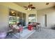 Cozy outdoor patio features wicker furniture and serene views at 265 Del Sol Ave, Davenport, FL 33837