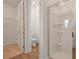 Bathroom featuring tiled floor, walk in shower with glass door, toilet, and walk in closet at 317 Alexandrite St, Deland, FL 32720