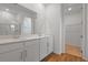Modern bathroom with double vanity, granite countertop, wood floors, and walk in shower at 317 Alexandrite St, Deland, FL 32720