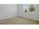 Cozy bedroom with neutral carpet and a bright window view at 317 Alexandrite St, Deland, FL 32720