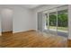 Bright bedroom featuring tile flooring and sliding glass door to the outdoors at 317 Alexandrite St, Deland, FL 32720