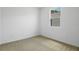 Bright bedroom with neutral carpet and window with natural light at 317 Alexandrite St, Deland, FL 32720