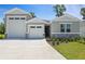 Charming single-Gathering home with a well-maintained lawn and a three car garage at 317 Alexandrite St, Deland, FL 32720