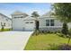 Charming single-Gathering home with a well-maintained lawn and a three car garage at 317 Alexandrite St, Deland, FL 32720
