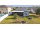 The property features a screened porch and a nicely maintained yard with landscaping at 3633 Bristol Cove Ln, St Cloud, FL 34772