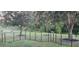 View of deer grazing in the backyard behind black metal fencing at 3633 Bristol Cove Ln, St Cloud, FL 34772