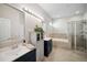 Well-lit bathroom featuring double vanities, a separate shower, and a luxurious soaking tub at 3633 Bristol Cove Ln, St Cloud, FL 34772