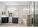 Contemporary bathroom with double sink vanity, tiled shower, and soaking tub with stone accents at 3633 Bristol Cove Ln, St Cloud, FL 34772