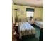 Bright bedroom with twin beds, offering a comfortable and inviting space at 406 E Grove Ave, Lake Wales, FL 33853