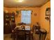 Cozy dining room with warm colors, a window, and comfortable seating at 406 E Grove Ave, Lake Wales, FL 33853