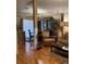 Cozy living room showcasing an open layout, wood floors, and comfortable seating at 406 E Grove Ave, Lake Wales, FL 33853