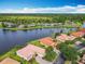 Beautiful home on a waterfront lot with mature trees, lush greenery, and tranquil lake views in a serene community at 644 Shorehaven Dr, Kissimmee, FL 34759
