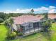Aerial view of the property featuring a red tile roof and a screened-in back patio at 644 Shorehaven Dr, Kissimmee, FL 34759