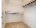 Walk-in closet with ample shelving and carpeted floor at 644 Shorehaven Dr, Kissimmee, FL 34759