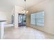 Dining area leads to a backyard patio through sliding glass doors and large picture windows at 644 Shorehaven Dr, Kissimmee, FL 34759