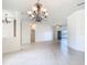 Bright and open living area with tile flooring, ceiling fan, and sliding doors to the lanai at 644 Shorehaven Dr, Kissimmee, FL 34759