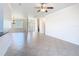 Spacious living area featuring tile floors, neutral walls, and seamless transition to other living spaces at 644 Shorehaven Dr, Kissimmee, FL 34759