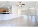 Open-concept living area with tile flooring, seamlessly connected to the kitchen and dining areas at 644 Shorehaven Dr, Kissimmee, FL 34759