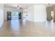 Large open-concept living space with tiled flooring, seamlessly connecting to the kitchen and dining areas at 644 Shorehaven Dr, Kissimmee, FL 34759