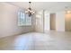 Spacious living area featuring tiled floors, high ceilings, and ample natural light at 644 Shorehaven Dr, Kissimmee, FL 34759