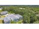 Beautiful aerial view of modern homes with private pools nestled amidst lush green trees at 1326 Butterfly Orchid Rd, Davenport, FL 33837