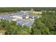 An aerial view of the community surrounded by lush trees at 1326 Butterfly Orchid Rd, Davenport, FL 33837