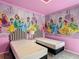 Themed bedroom with princess decor and two twin beds at 1326 Butterfly Orchid Rd, Davenport, FL 33837