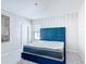 Cozy bedroom featuring a comfortable bed, natural light, and modern decor at 1326 Butterfly Orchid Rd, Davenport, FL 33837
