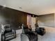 Cozy theater room featuring comfortable leather recliners, perfect for movie nights at 1326 Butterfly Orchid Rd, Davenport, FL 33837