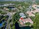 Aerial view of property with lakes, clubhouse, and manicured landscaping at 1357 Venezia Ct # 202, Davenport, FL 33896
