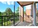 Balcony with tile flooring, metal railing, and a view of the trees at 1357 Venezia Ct # 202, Davenport, FL 33896