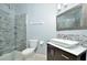 Modern bathroom featuring a glass shower, stylish tiling, and a vessel sink at 1357 Venezia Ct # 202, Davenport, FL 33896