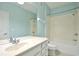 Bright bathroom featuring a vanity, large mirror, and shower-tub combo, designed for comfort at 1357 Venezia Ct # 202, Davenport, FL 33896