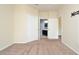 Neutral bedroom with carpet, two doors, and a bathroom visible through one at 1357 Venezia Ct # 202, Davenport, FL 33896
