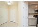 Entryway features tile floors, closet, and convenient access to kitchen at 1357 Venezia Ct # 202, Davenport, FL 33896