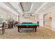 Community game room featuring a well-lit billiards table for residents' entertainment at 1357 Venezia Ct # 202, Davenport, FL 33896