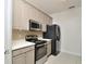 Bright kitchen featuring stainless steel appliances, and ample counter space at 1357 Venezia Ct # 202, Davenport, FL 33896