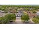 Aerial shot of a home in a verdant neighborhood with tree-lined streets at 1559 Wescott Loop, Winter Springs, FL 32708