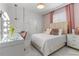 Stylish bedroom with a glam vanity area, modern lighting, and cozy hanging chair creating the perfect relaxing atmosphere at 1559 Wescott Loop, Winter Springs, FL 32708