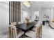 Dining room featuring modern decor with stylish seating, a chandelier, and view of the living room at 1559 Wescott Loop, Winter Springs, FL 32708