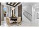 Dining area featuring a long table with seating for eight and a modern chandelier at 1559 Wescott Loop, Winter Springs, FL 32708
